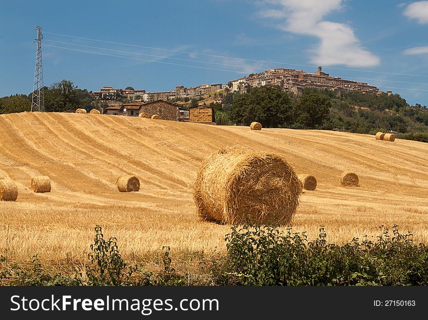 Tuscan countryside with bales of hay