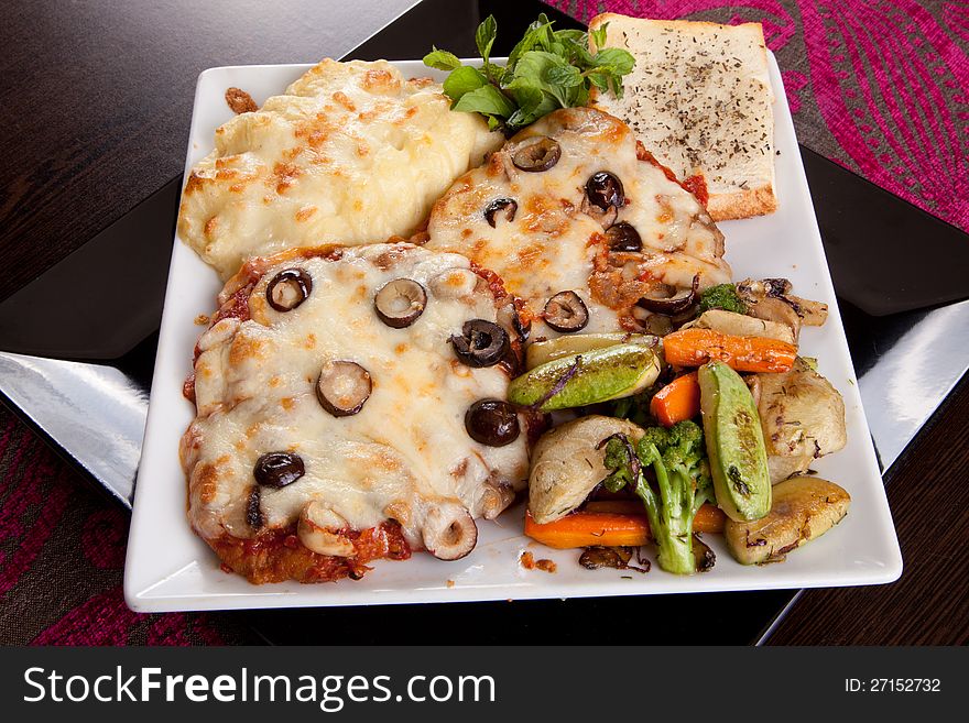 Italian Chicken with mozzarella cheese , mixed peppers, Vegetables , olive and Parmesan sauce. Italian Chicken with mozzarella cheese , mixed peppers, Vegetables , olive and Parmesan sauce