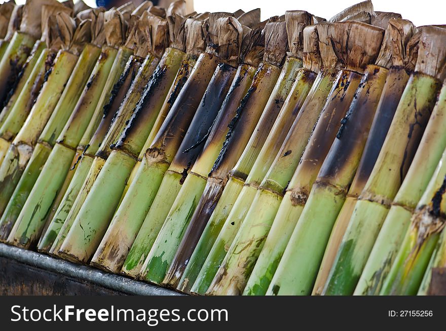 Glutinous rice roasted in bamboo joints.