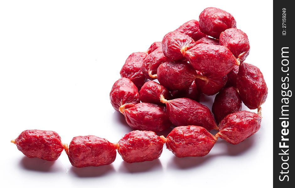 Smoked sausages on white background. Smoked sausages on white background