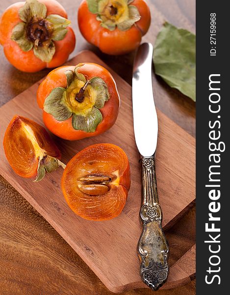 Persimmon on a wooden table