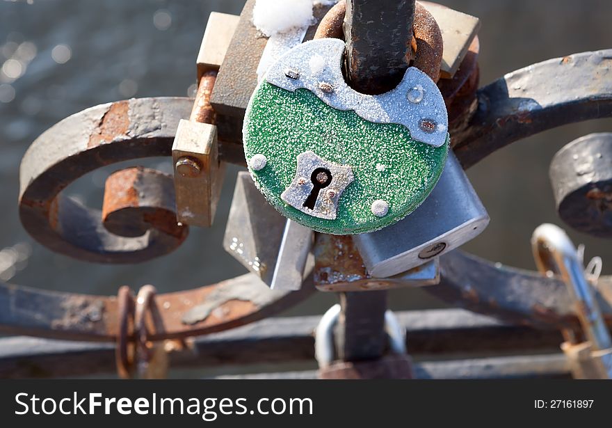 Love padlocks - symbol of eternal happiness.  Love padlocks hanging on the railing of the bridge