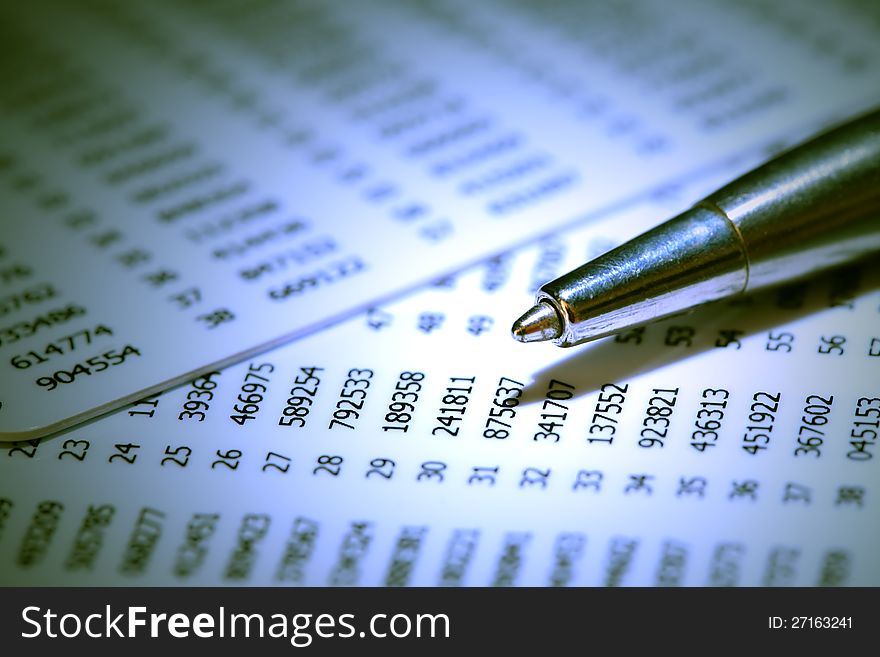 Closeup of pen on abstract number background. Closeup of pen on abstract number background