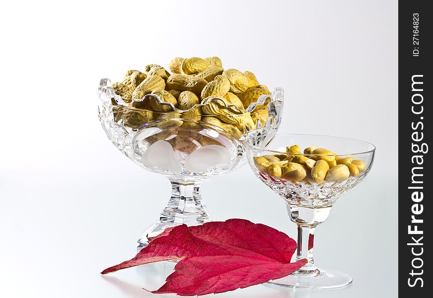 Peanuts, shelled and unshelled decorated with a wine leaf