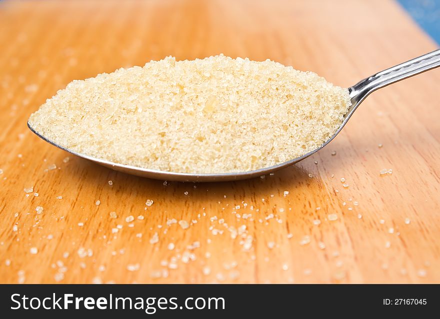 Close up cane sugar in the spoon
