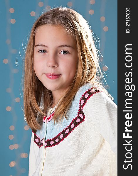 Portrait of lovely kid girl wearing winter clothing in the studio. Portrait of lovely kid girl wearing winter clothing in the studio.