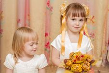 Two Little Girl With Bouquet Of Autumn Leaves Stock Photo