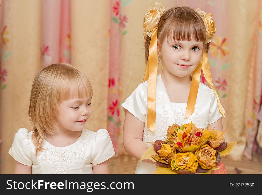 Two Little Girl With Bouquet Of Autumn Leaves