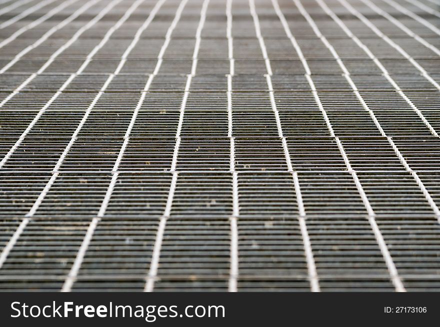 Perspective of shiny metal grill grid floor. Perspective of shiny metal grill grid floor