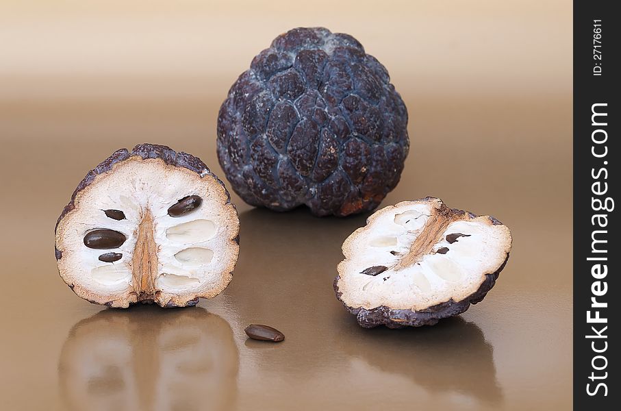 Dried custard apples on beige background. Dried custard apples on beige background.