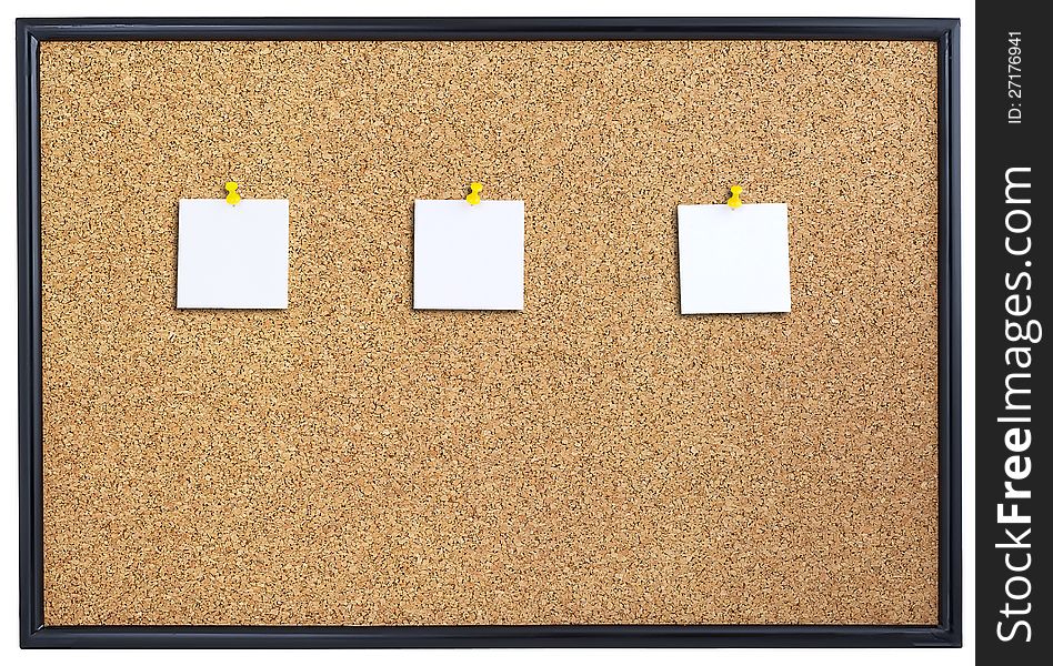 Cork board with three pieces of paper pinned. Cork board with three pieces of paper pinned.