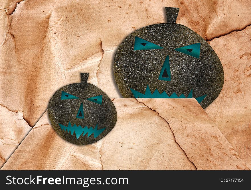 Two Halloween Pumpkins isolated on brown walls background. Two Halloween Pumpkins isolated on brown walls background.