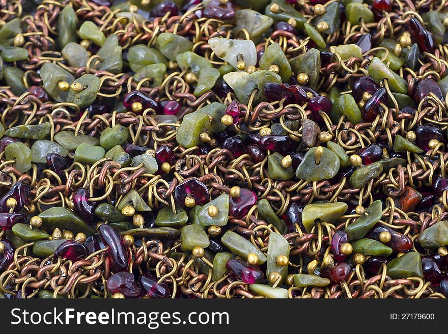 Background of vintage rough stones necklace closeup. Background of vintage rough stones necklace closeup.