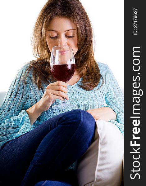 Attractive Woman Relaxing With A Glass Of Red Wine