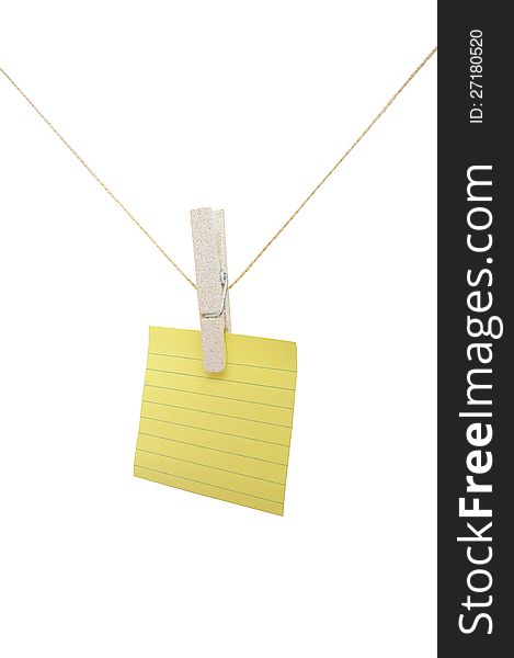 Yellow lined post-it note on a string on a white isolated background. Yellow lined post-it note on a string on a white isolated background