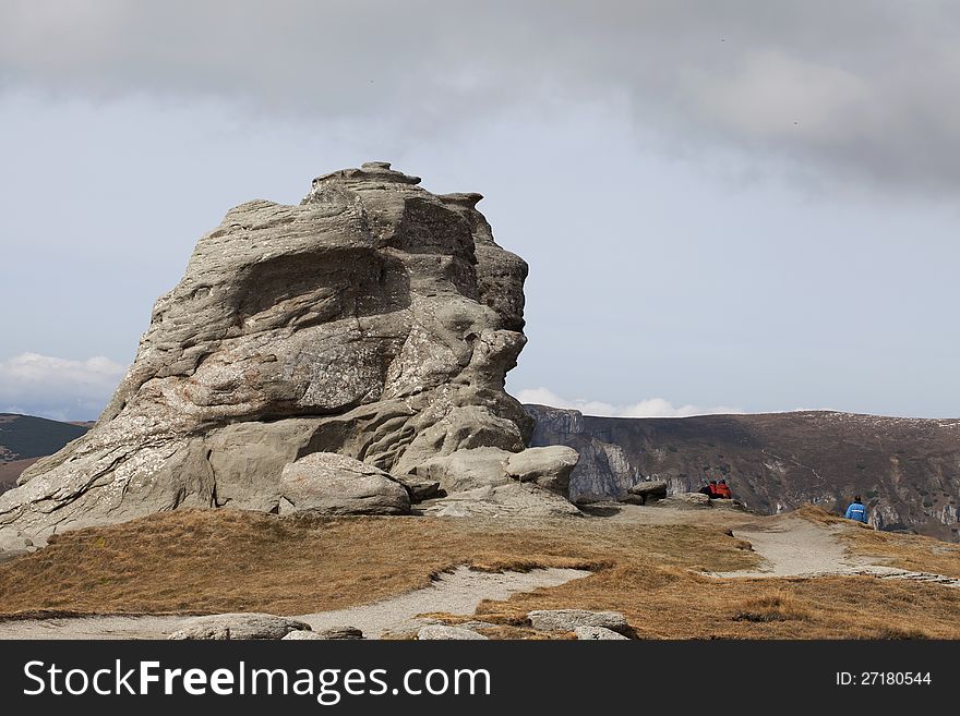 People admiring sphinx