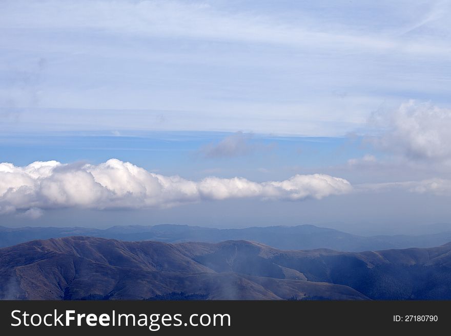 White clouds flying on carpathian mountains range landscape