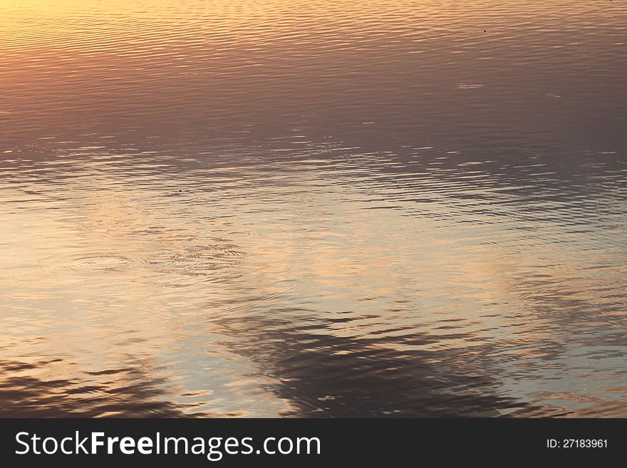 Rising sun reflected on a lake. Rising sun reflected on a lake