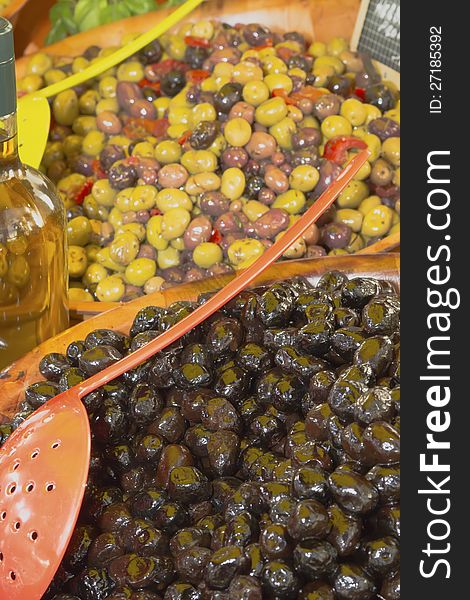 Assortment of olives, pickles and salads on market stand.(Provence, France). Assortment of olives, pickles and salads on market stand.(Provence, France)