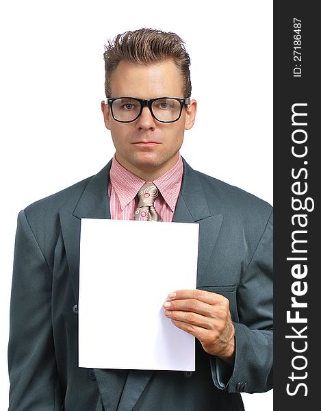 Caucasian businessman with glasses in fashionable suit holds blank paper with copy space on white background. Caucasian businessman with glasses in fashionable suit holds blank paper with copy space on white background