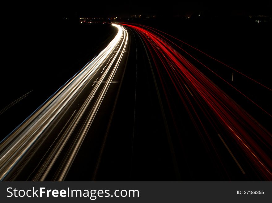 Night lights of the cars under the highway bridge. Night lights of the cars under the highway bridge