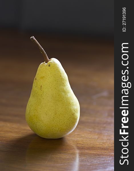 Pear on the wood background, natural light