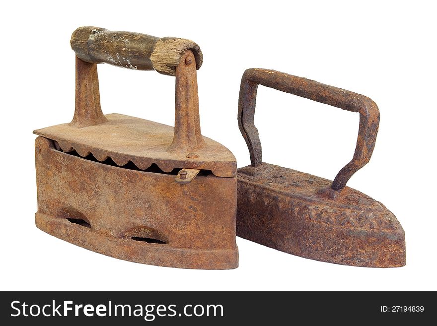 Two old metal iron on a white background. Two old metal iron on a white background