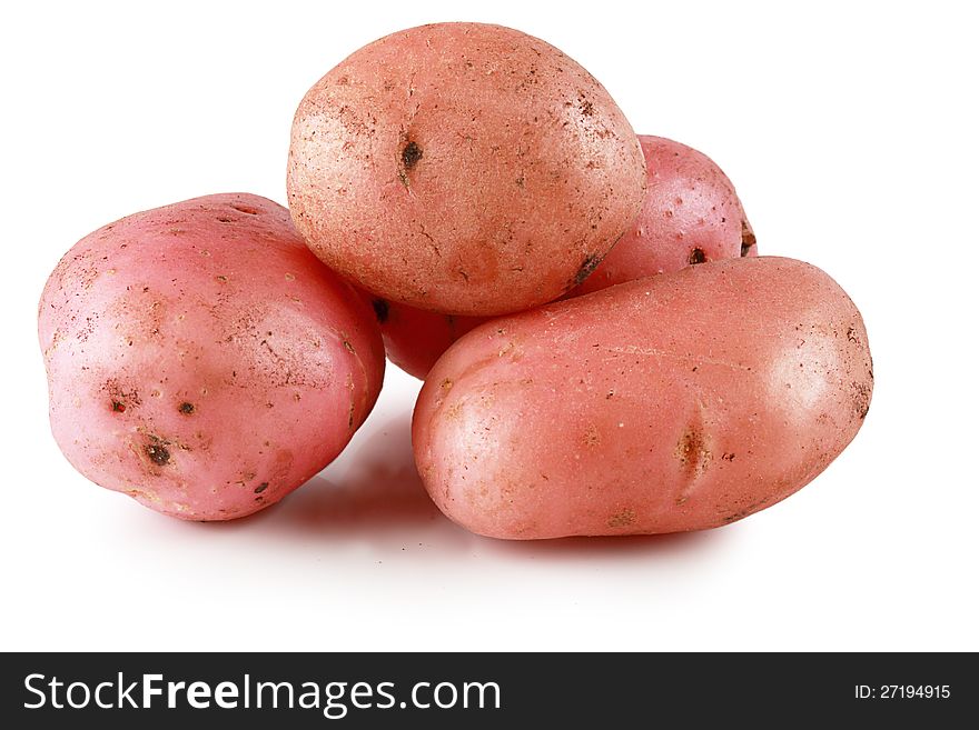 Ripe fresh potatoes on a white background. Ripe fresh potatoes on a white background.