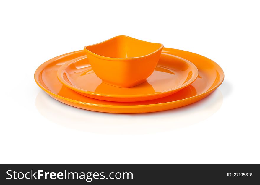 Close up of plastic microwave bowl and plate isolated over white. Close up of plastic microwave bowl and plate isolated over white