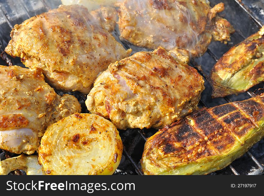 Slices of chicken with vegetables grilled at weekend in the summer. Slices of chicken with vegetables grilled at weekend in the summer