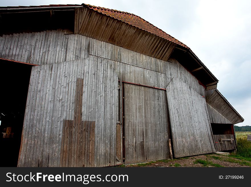 Old vintage barn in a farm agriculture background image. Old vintage barn in a farm agriculture background image