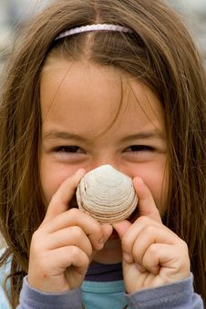 Happy Child With A SeaShell Royalty Free Stock Images Happy Child With A SeaShell Royalty Free Stock Images