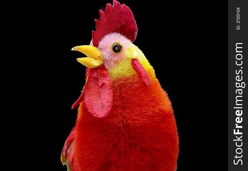 Beautiful toy rooster with colorful feathers