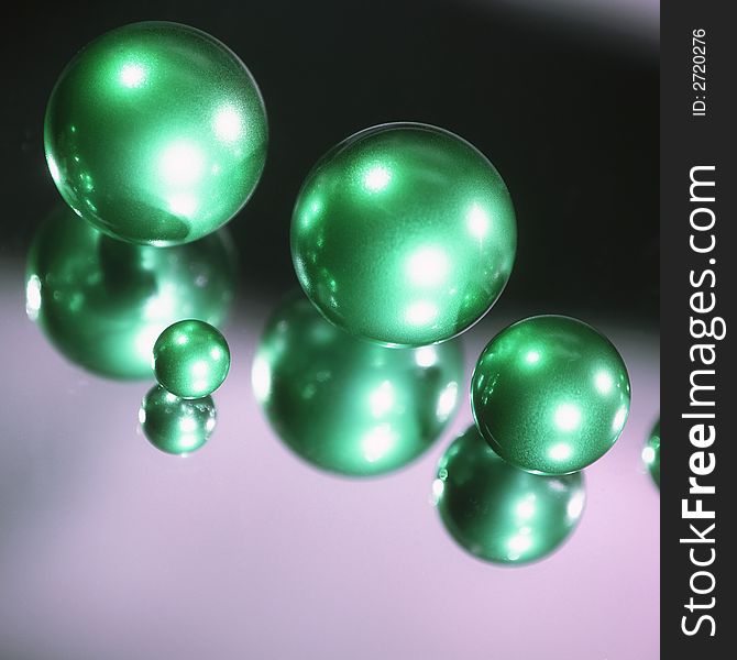 Green spheres on a black background