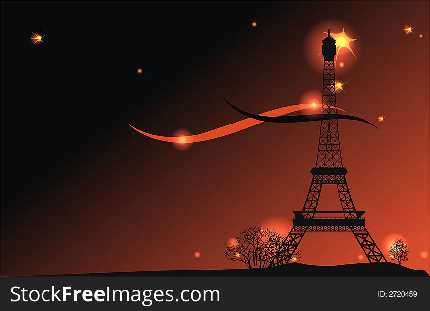 Silhouette of the Eiffel Tower against an evening sky