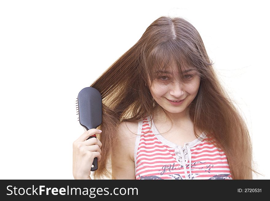 Young girl brushing her long dark hair