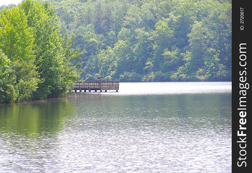 Beautiful view of wooden pier on lake oolenoy