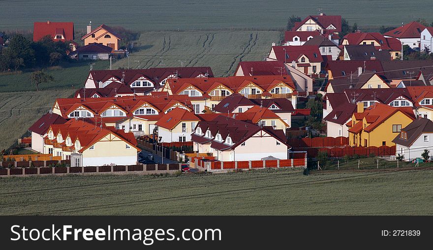 An area with new houses build in  green fields. An area with new houses build in  green fields