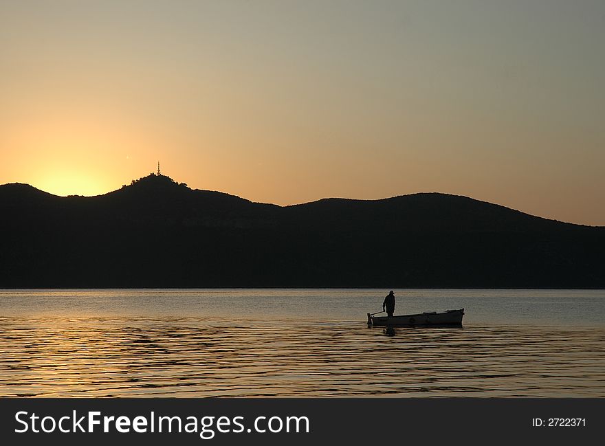 Fisherman in a small fisher boat. Fisherman in a small fisher boat