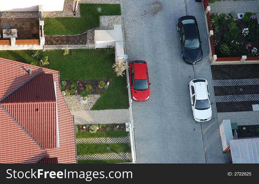 Air view of a street with cars and driveways. Air view of a street with cars and driveways
