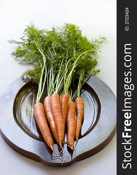 A bunch of garden fresh carrots ready to be eaten or cooked