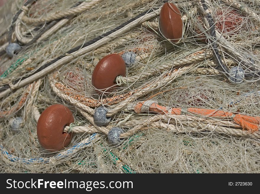 Fishing net to fish posed on the quay