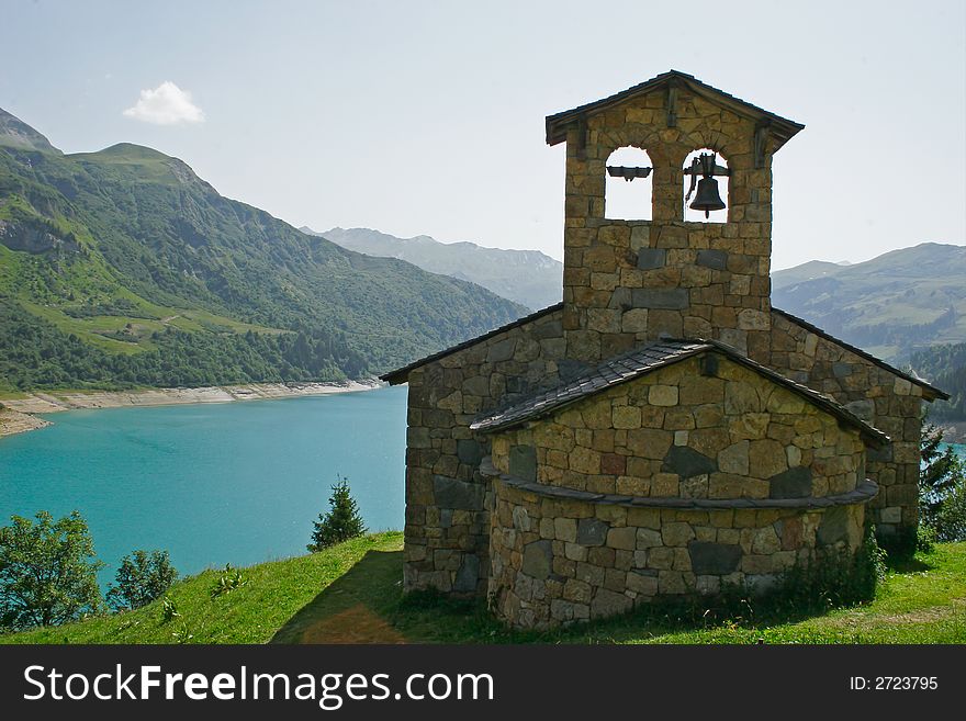 Old church at the edge of a lake in mountain. Old church at the edge of a lake in mountain