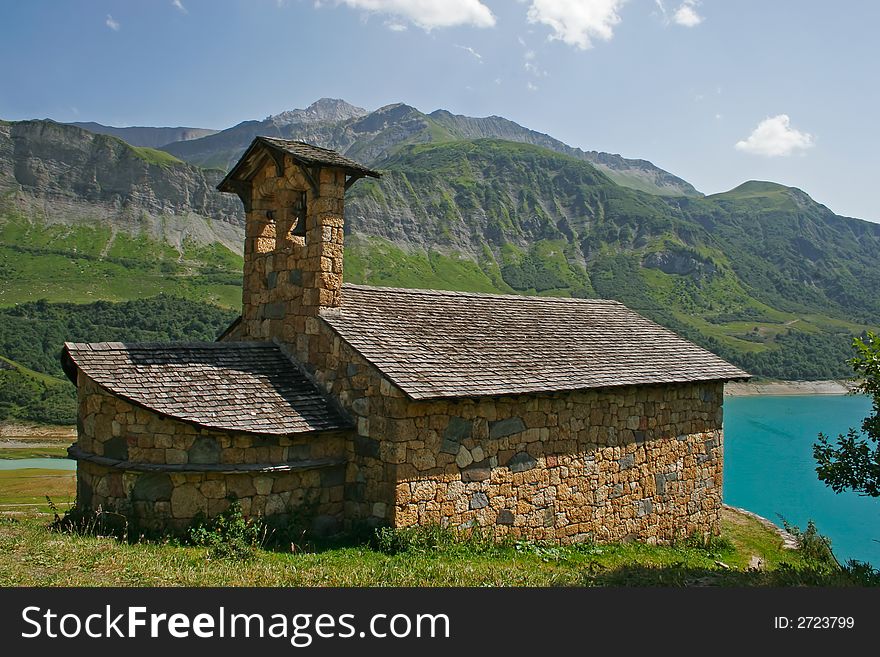 Old church at the edge of a lake in mountain. Old church at the edge of a lake in mountain