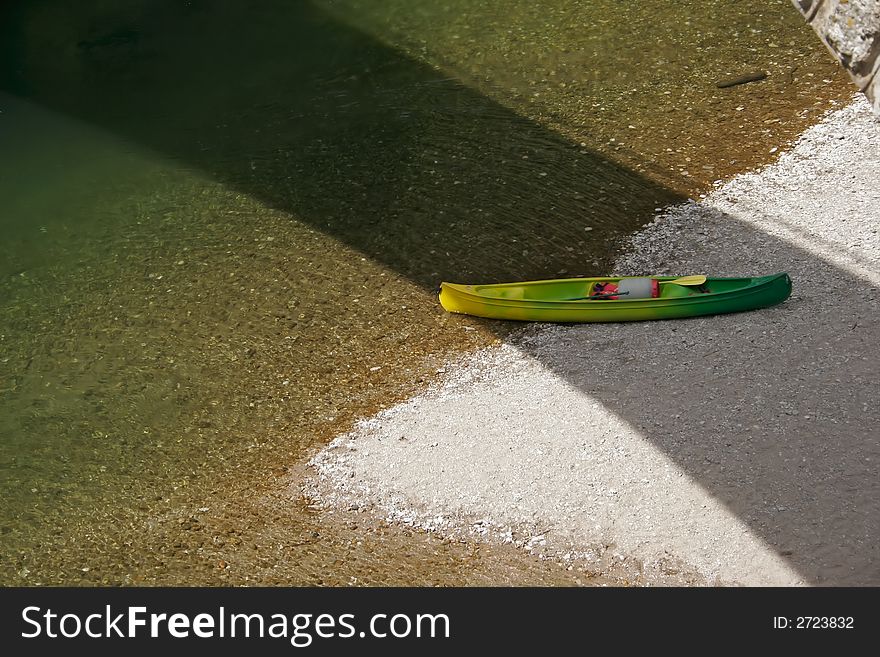 Canoe at the edge of a river with its
paddles. Canoe at the edge of a river with its
paddles