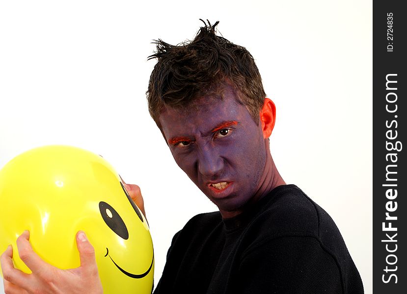 A yellow balloon and an angry man. A yellow balloon and an angry man