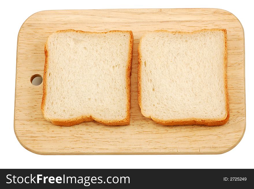 Two pieces toast bread on a cutting board isolated over white background