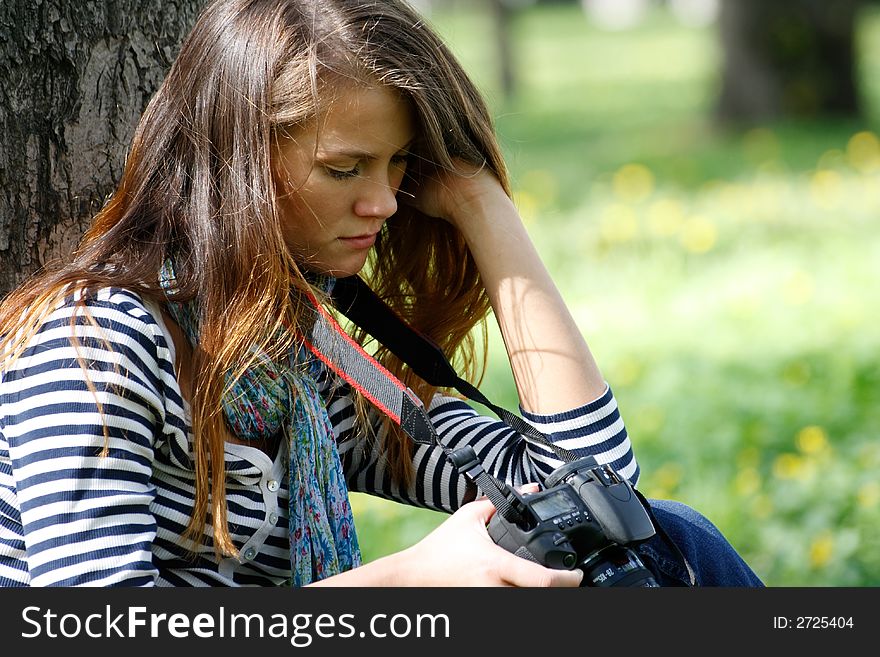 The girl-photographer in spring park