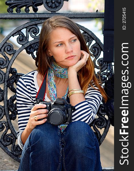 The girl-photographer in spring park. The girl-photographer in spring park