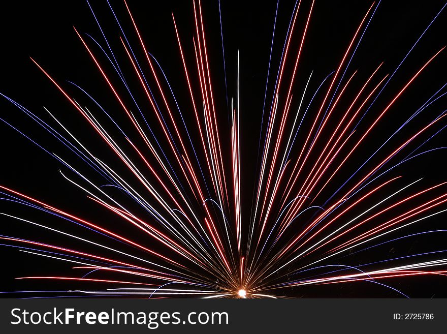 An image of exploding fireworks at night.